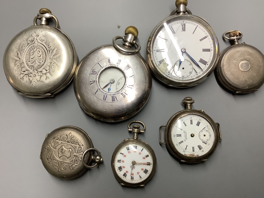 A silver half hunter pocket watch and six other white metal pocket or fob watches